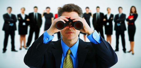 Businessman with binoculars.